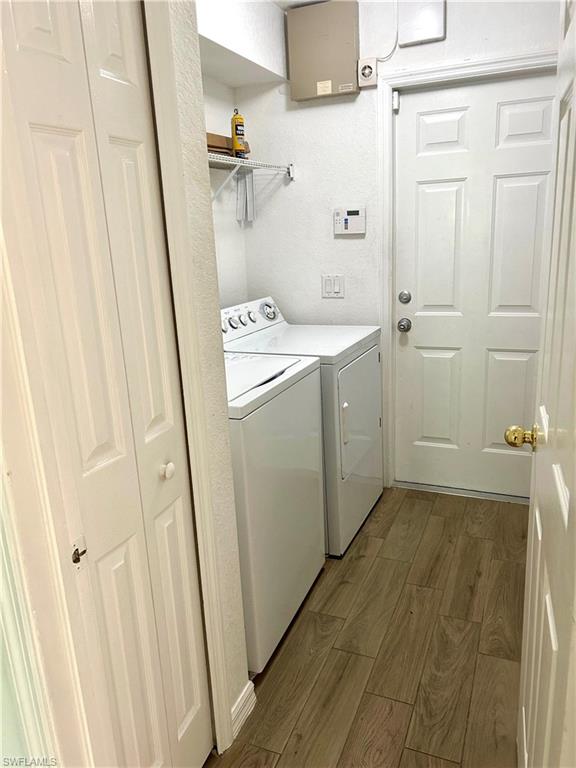 Empty room with wood finished floors and ceiling fan