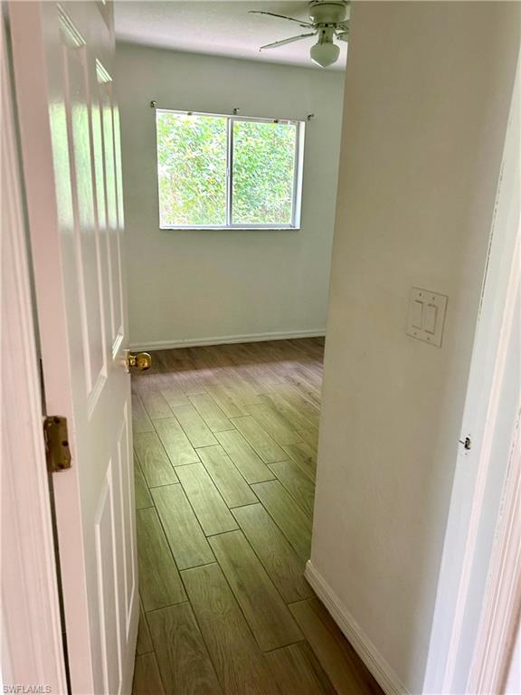 Full bathroom featuring shower / bathtub combination, vanity, and light wood finished floors