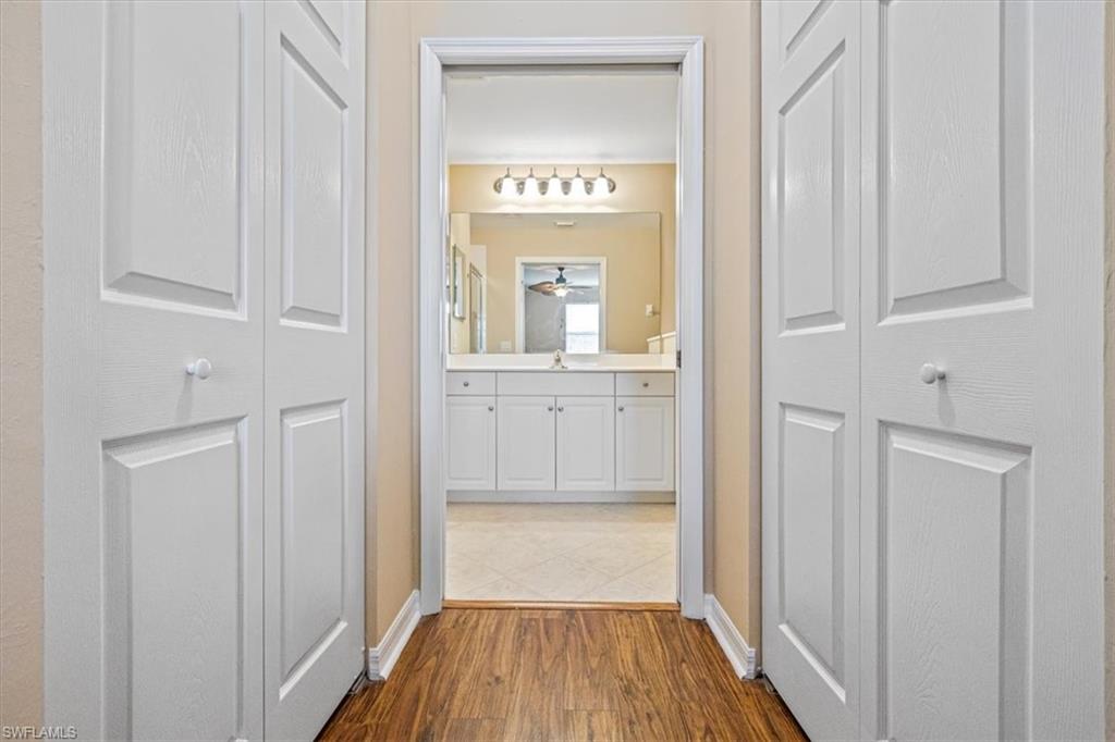 Hall featuring light wood-style flooring and baseboards
