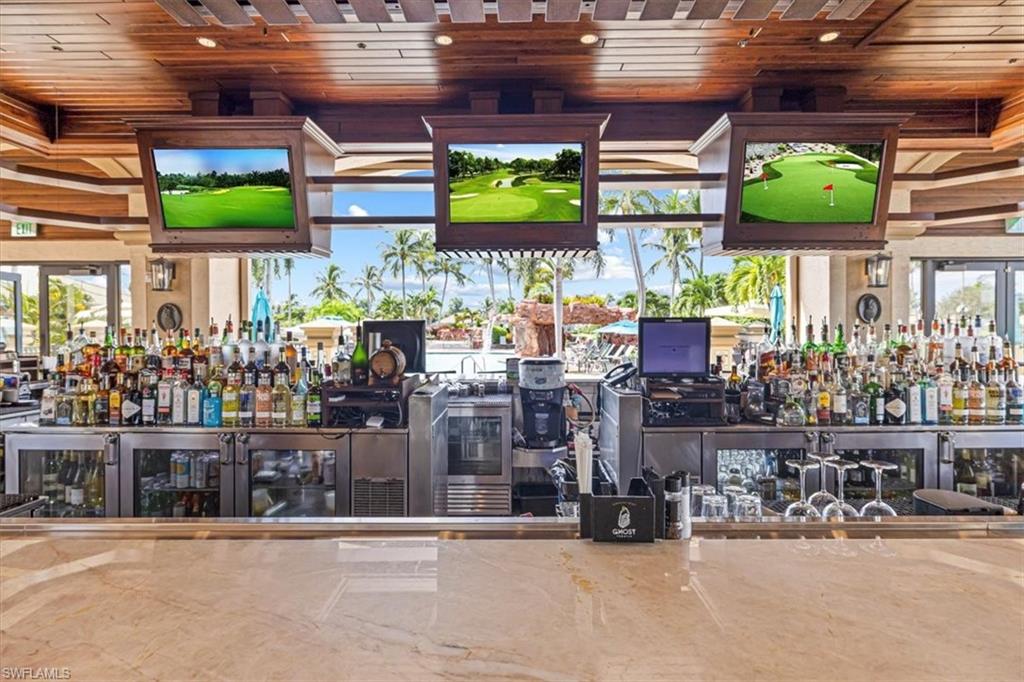 Indoor wet bar featuring wooden ceiling and healthy amount of natural light