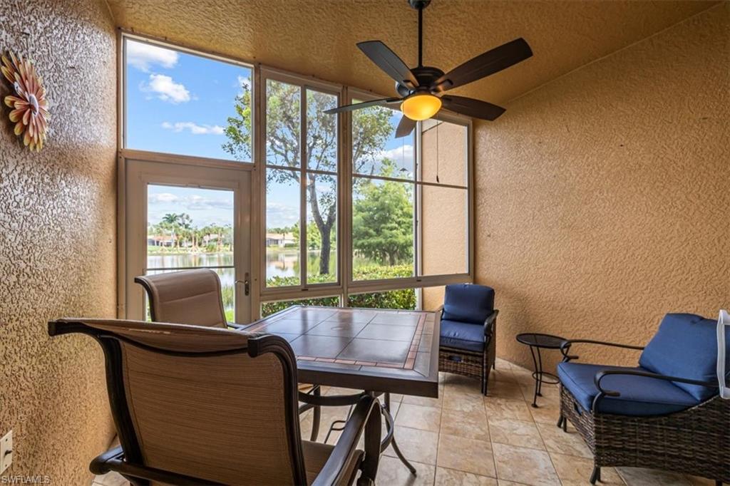 Sunroom with a ceiling fan, healthy amount of natural light, and outdoor dining space
