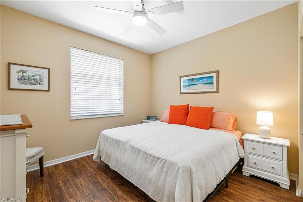Bedroom featuring dark wood-type flooring and ceiling fan