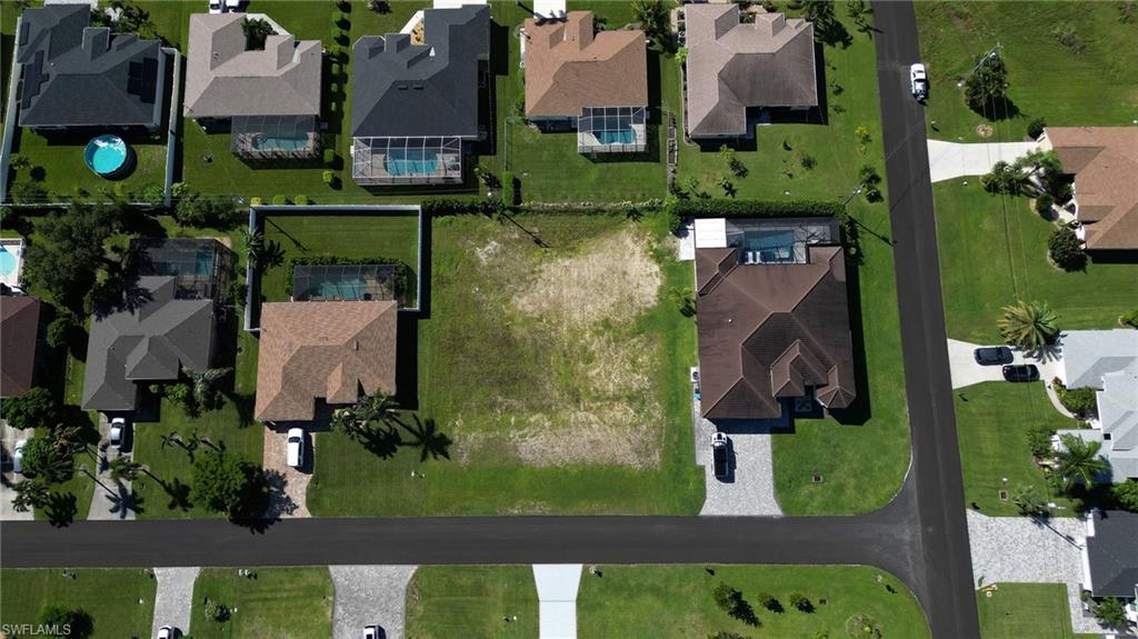 Aerial overview of property's location with nearby suburban area