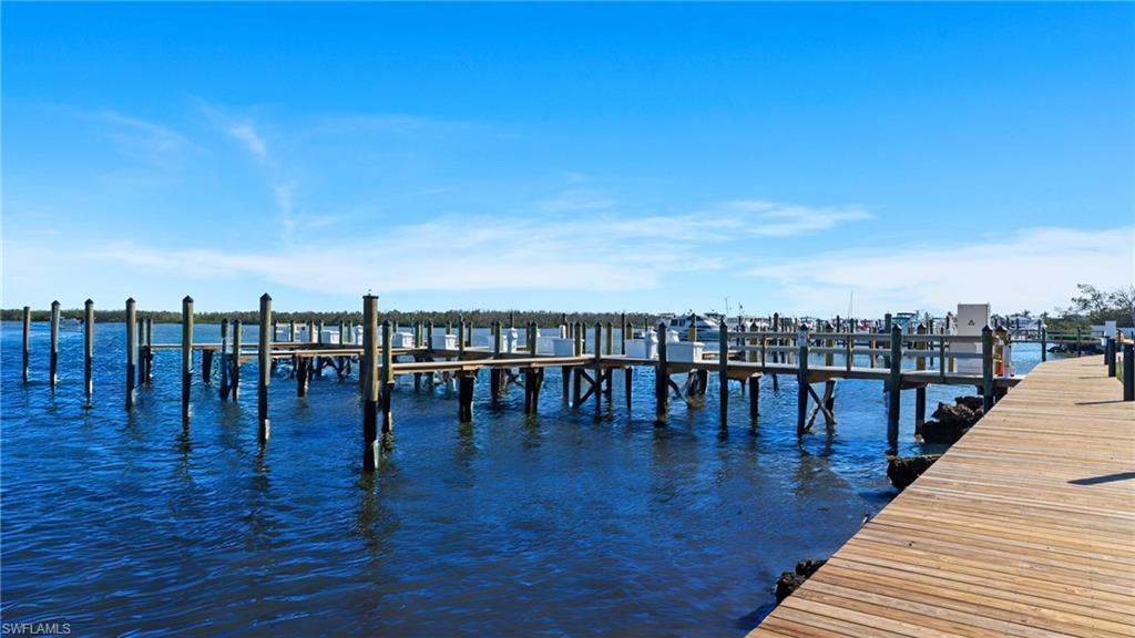 VIRTUALLY ENHANCED - Dock area featuring a water view