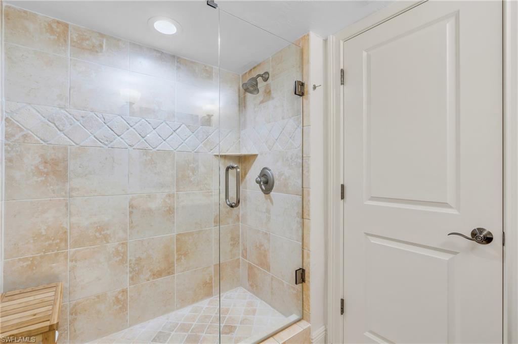 Bathroom featuring a shower with door / vrtually enhanced image