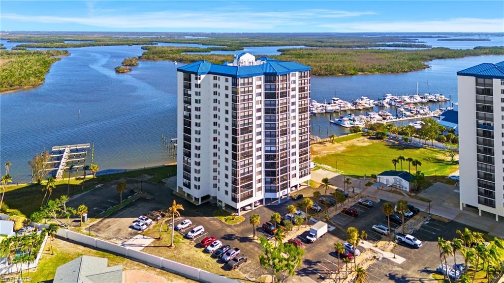Birds eye view of property with a water view virtually enhanced image