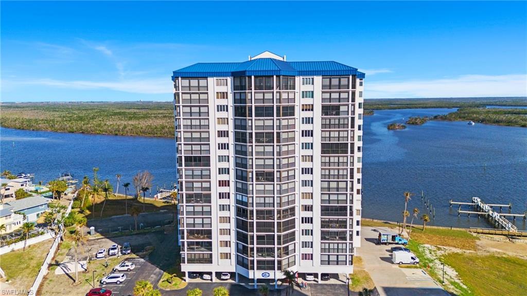 View of property with a water view virtually enhanced image