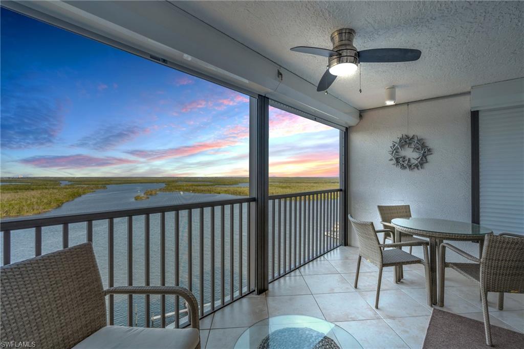 VIRTUALLY ENHANCED - Balcony at dusk with ceiling fan / virtually enhanced image