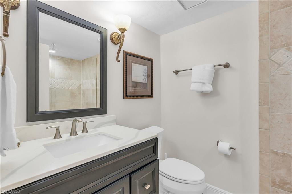 Bathroom with vanity and toilet / virtually enhanced image
