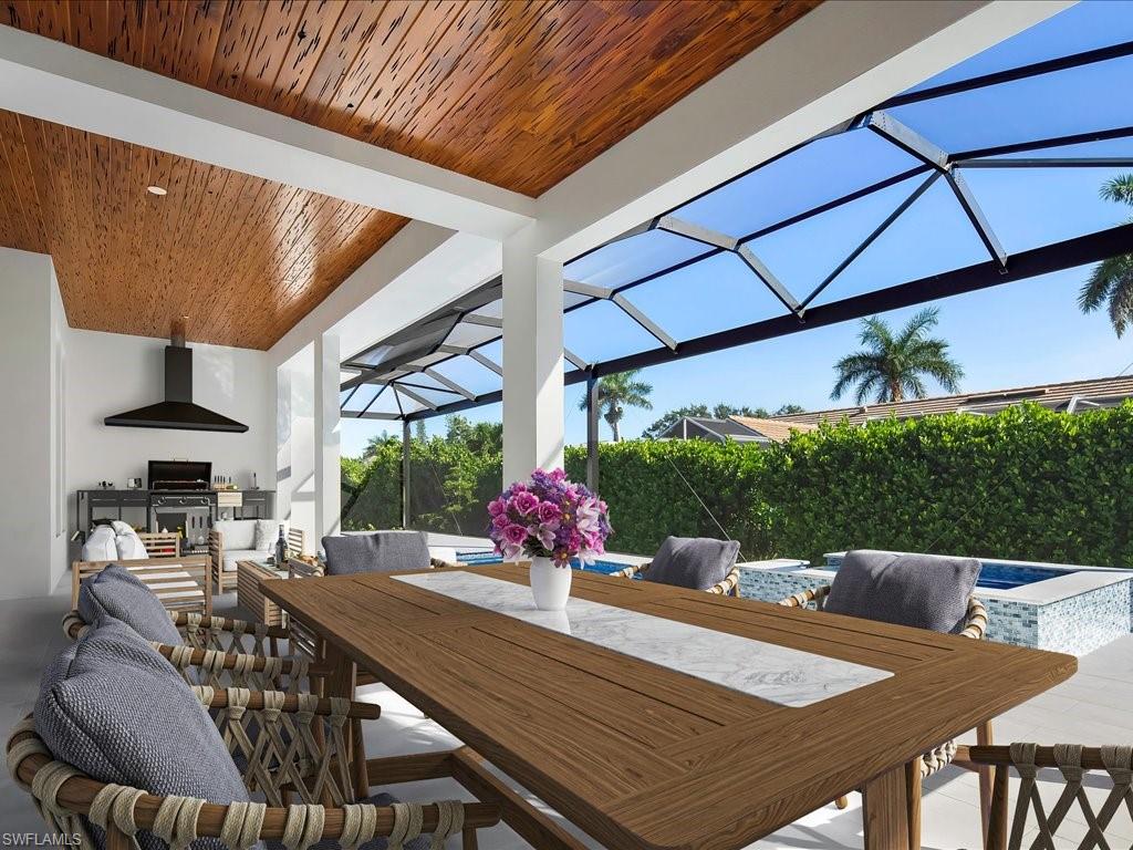 Virtually Staged- View of patio / terrace with area for grilling, glass enclosure, a sunroom, outdoor dining area, and an outdoor pool