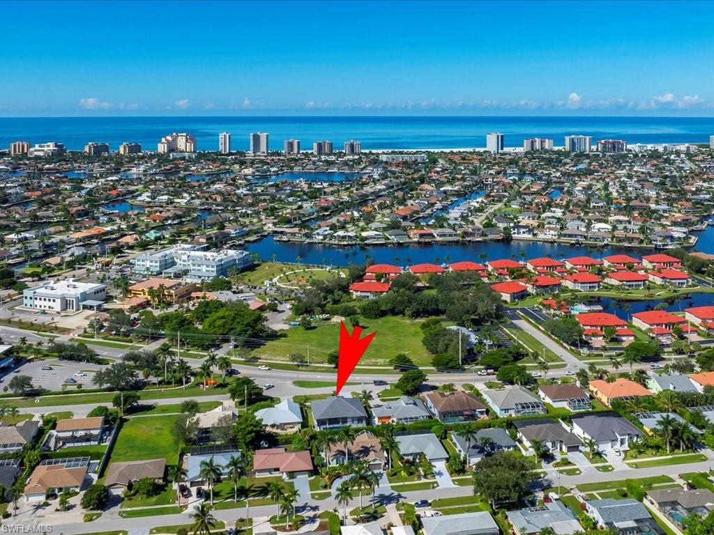 View of property location with nearby suburban area and a large body of water