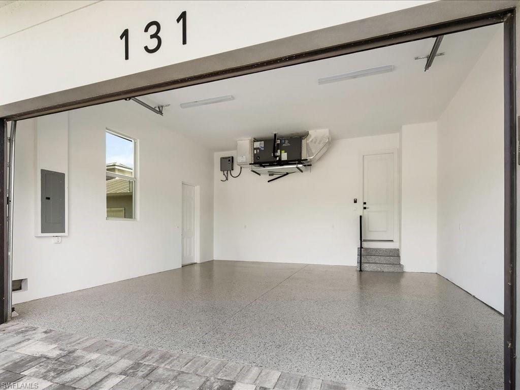 Garage featuring electric panel