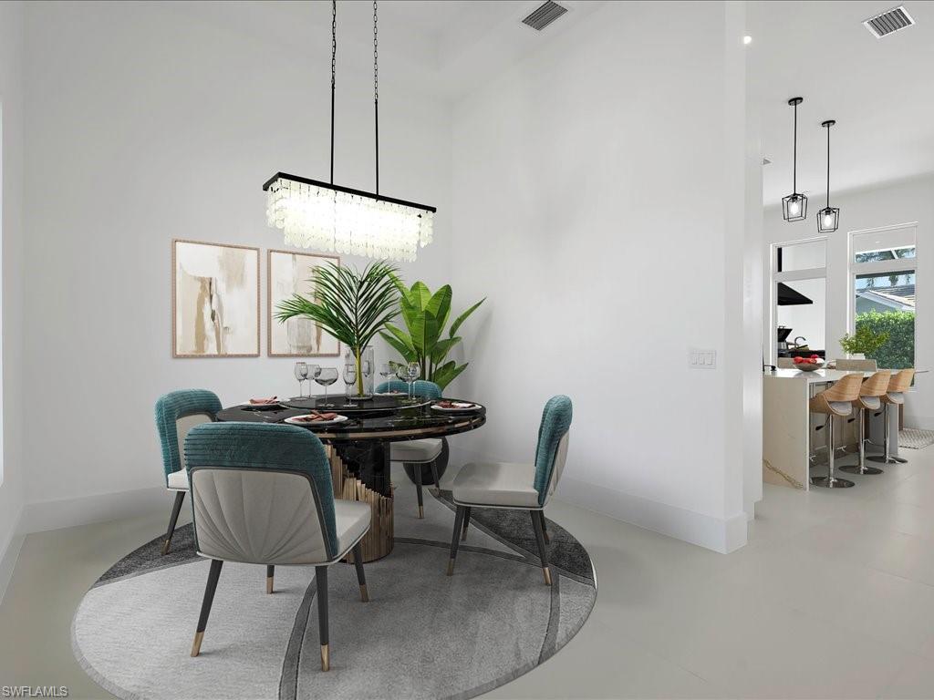 Virtually Staged-Dining space featuring baseboards and a towering ceiling