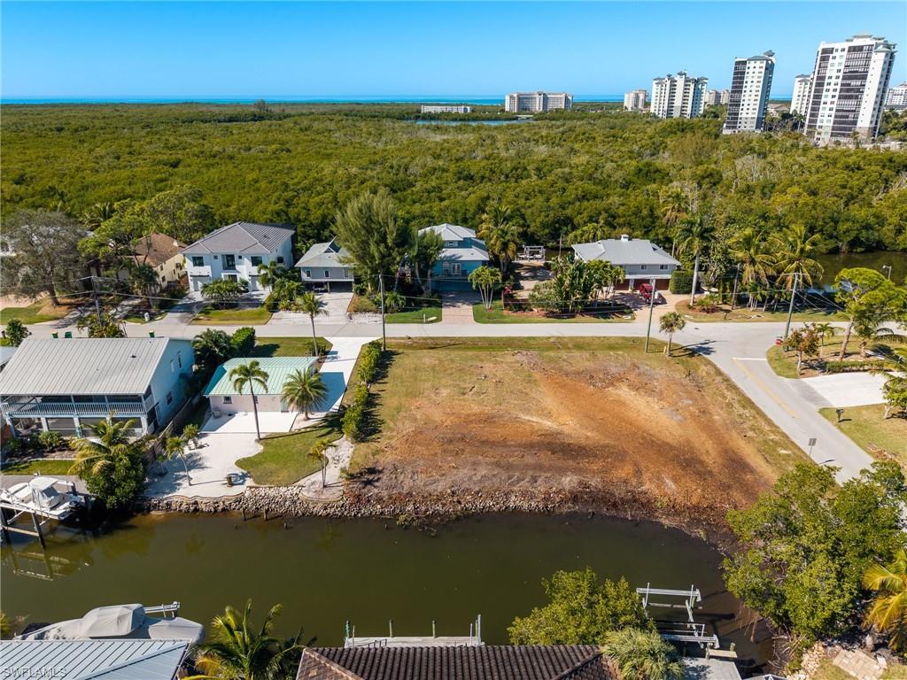 Bird's eye view of a large body of water and a heavily wooded area