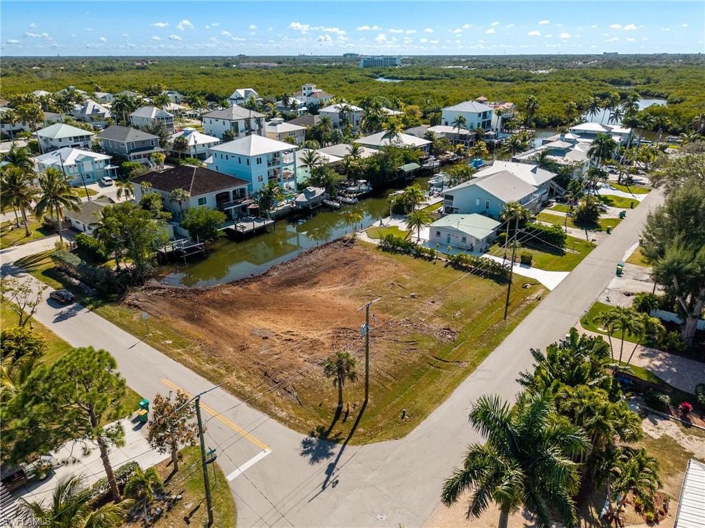Aerial view of residential area with a nearby body of water