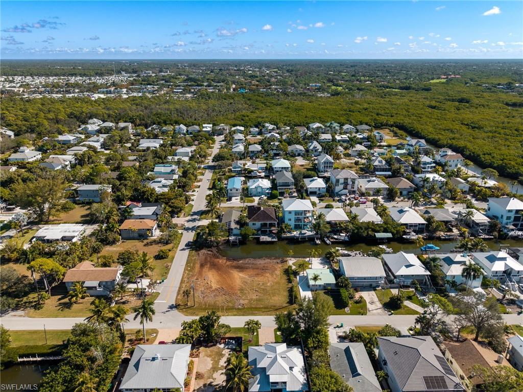 View of property location with nearby suburban area