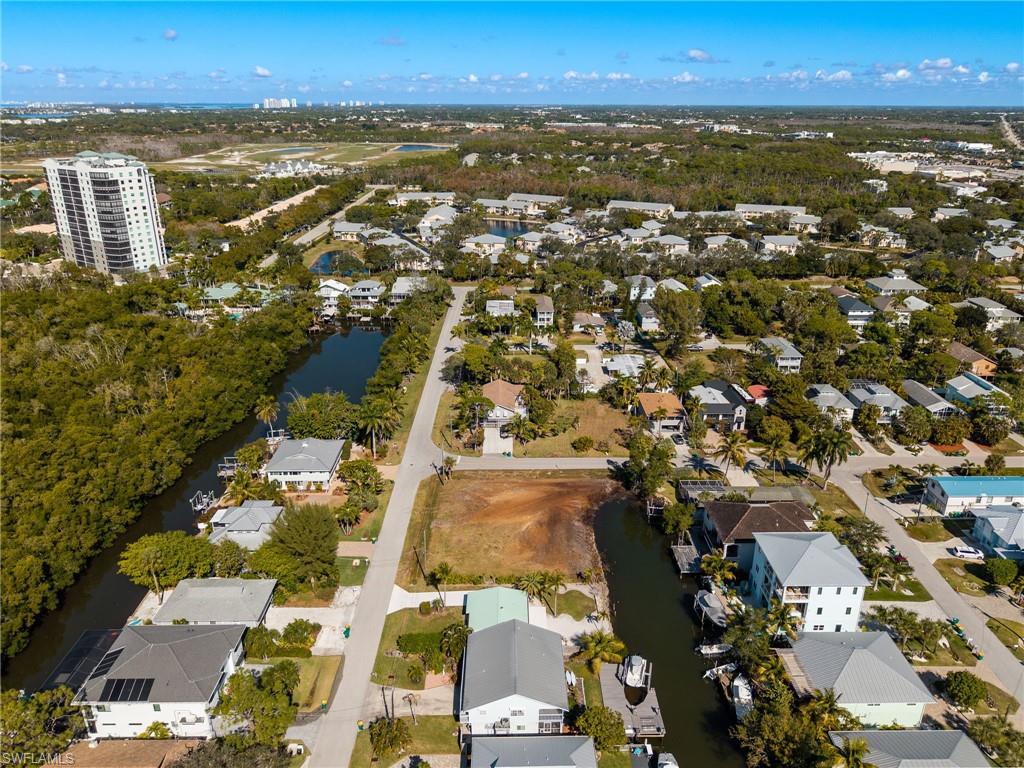 Aerial overview of property's location with nearby suburban area and a large body of water