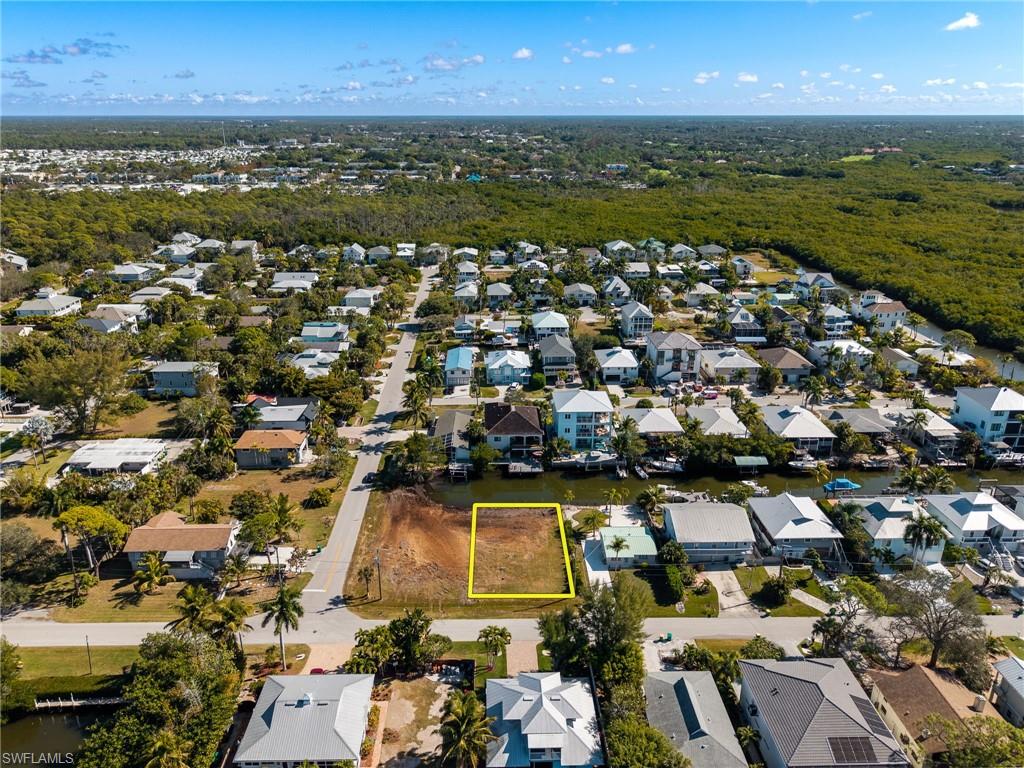 Aerial overview of property's location with nearby suburban area