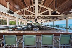Bar featuring lofted ceiling