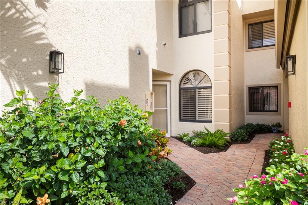Property entrance featuring stucco siding