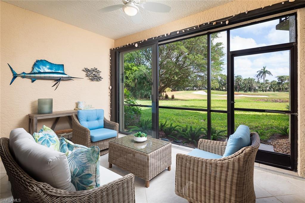 Sunroom / solarium featuring an outdoor living space, ceiling fan, and golf course view