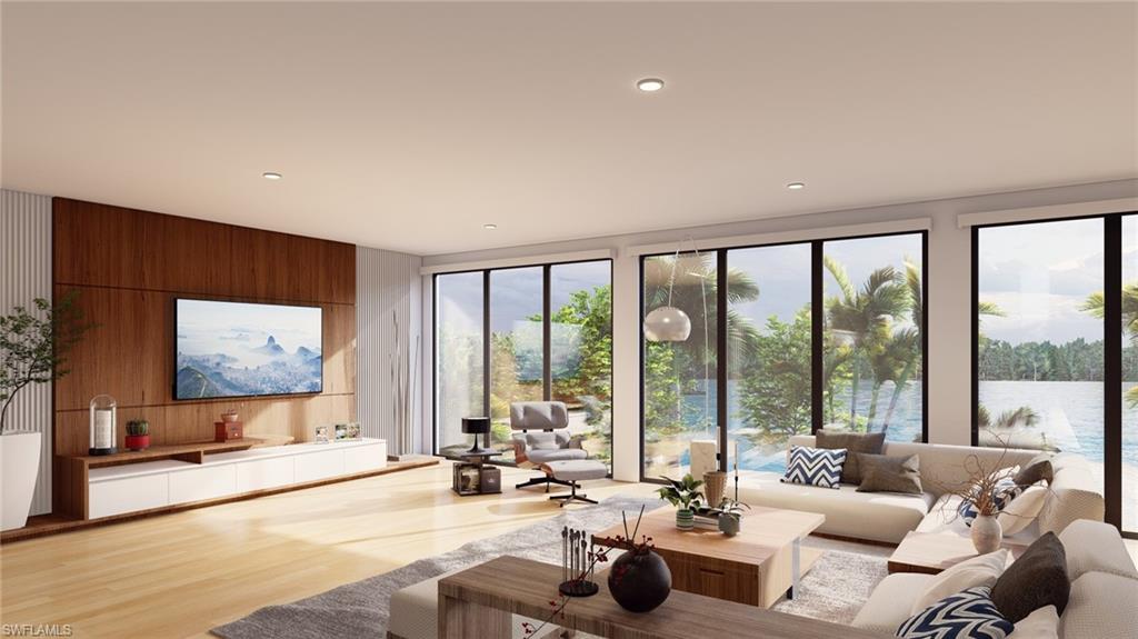 Living room featuring wooden walls, wood finished floors, recessed lighting, and floor to ceiling windows