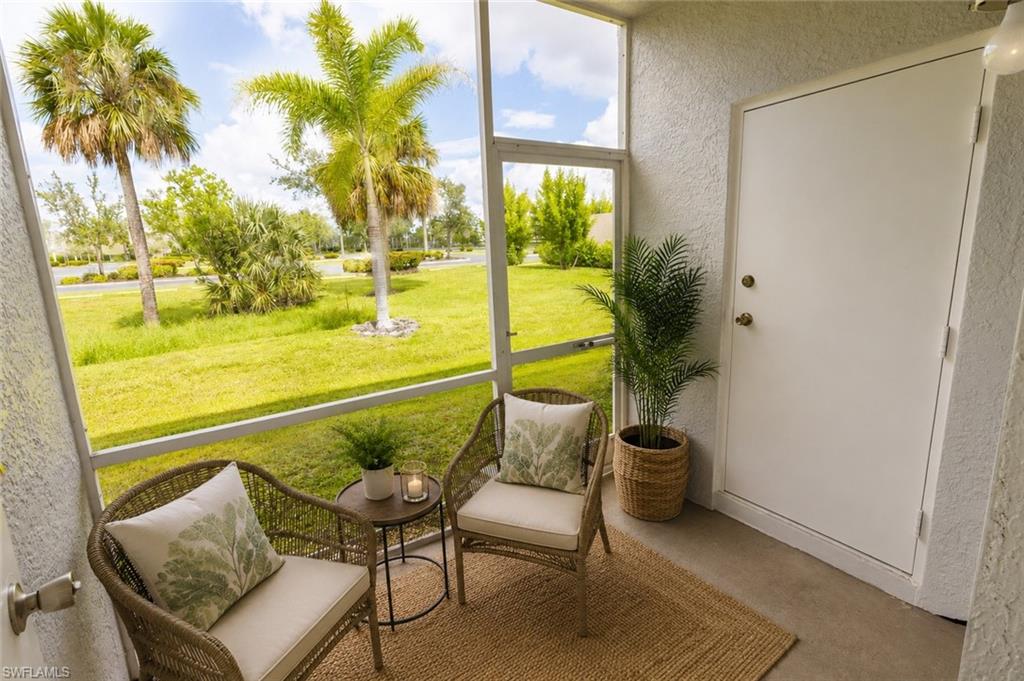 Screened lanai featuring concrete flooring and textured walls