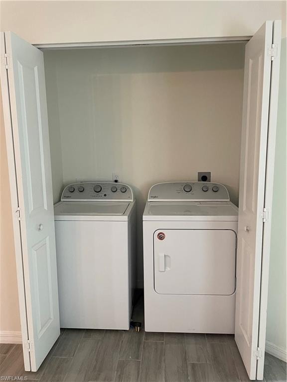 Washroom featuring washing machine and dryer