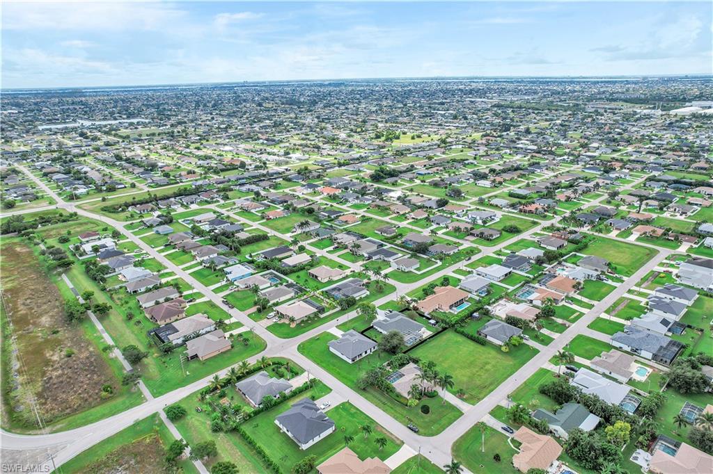 View of property location with nearby suburban area