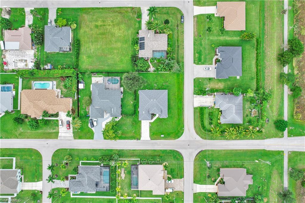 Aerial overview of property's location with nearby suburban area