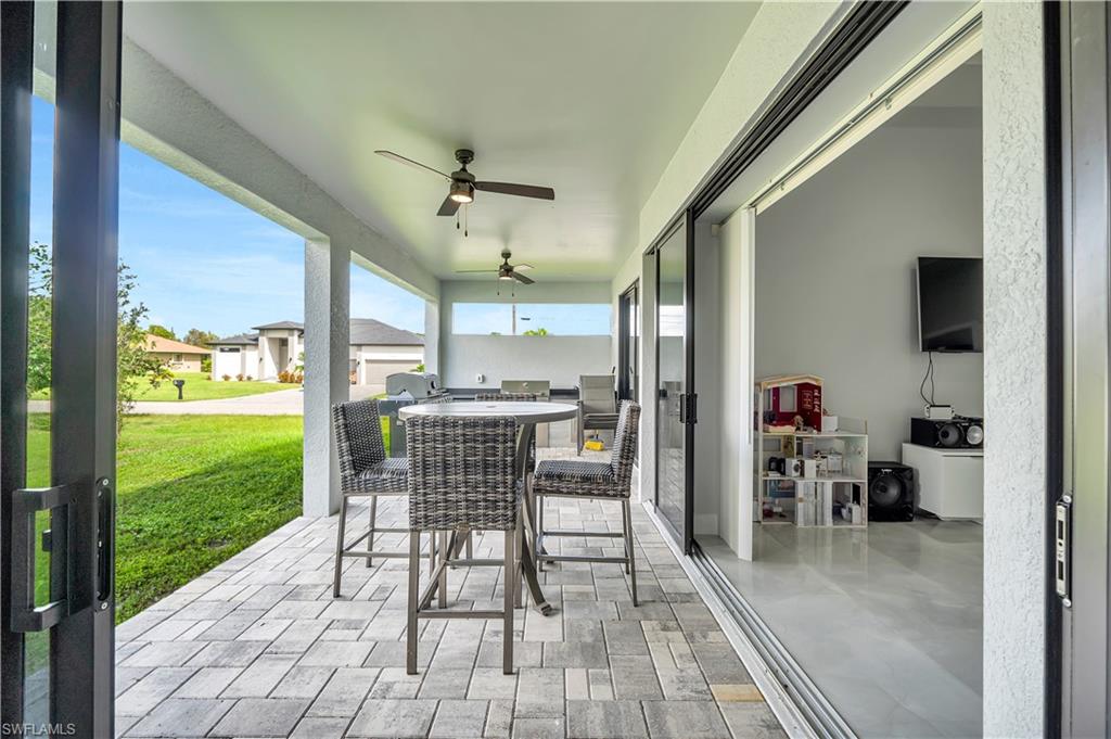 View of patio / terrace with outdoor dining space and a ceiling fan