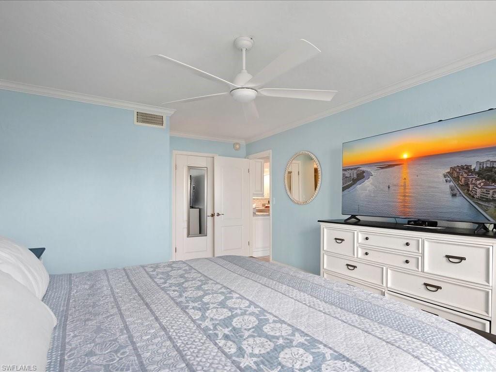 Bedroom featuring ornamental molding and a ceiling fan