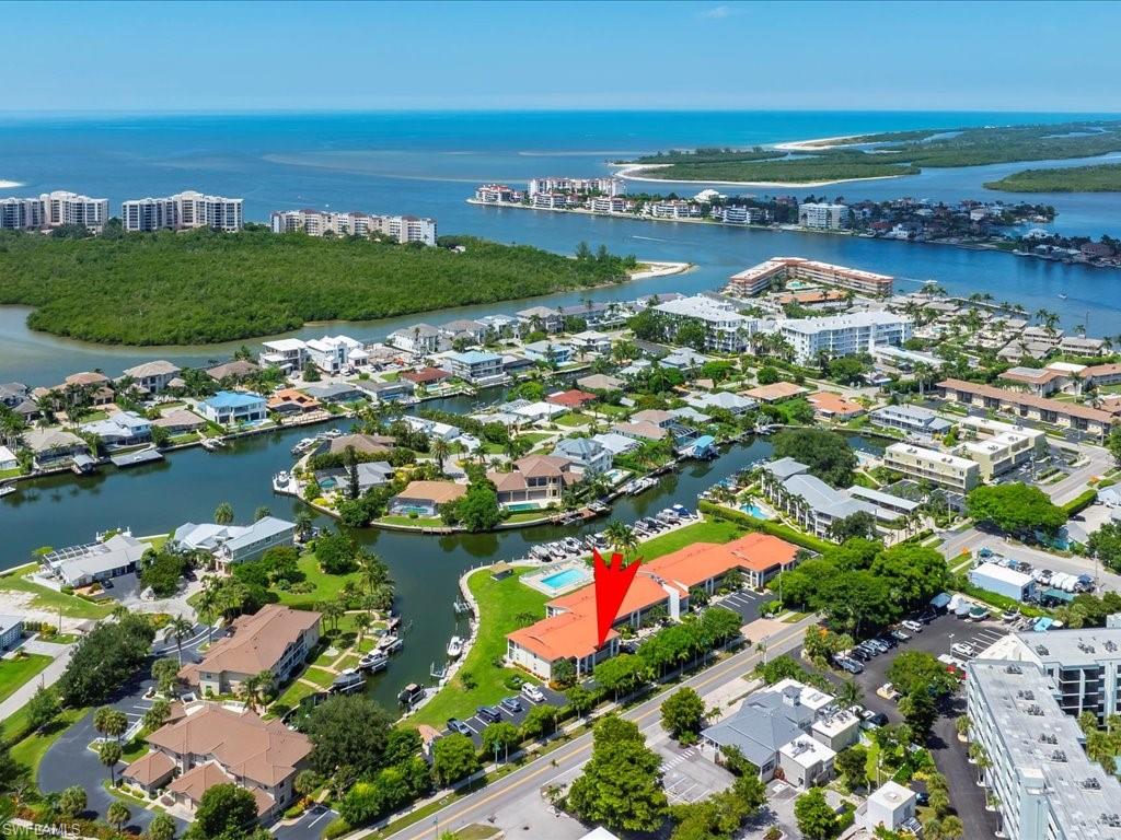 Aerial view of property's location featuring a nearby body of water