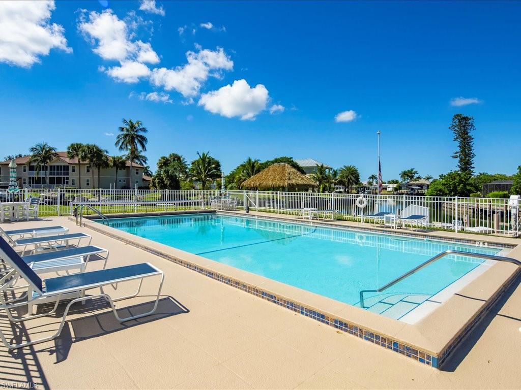 Community pool featuring a patio
