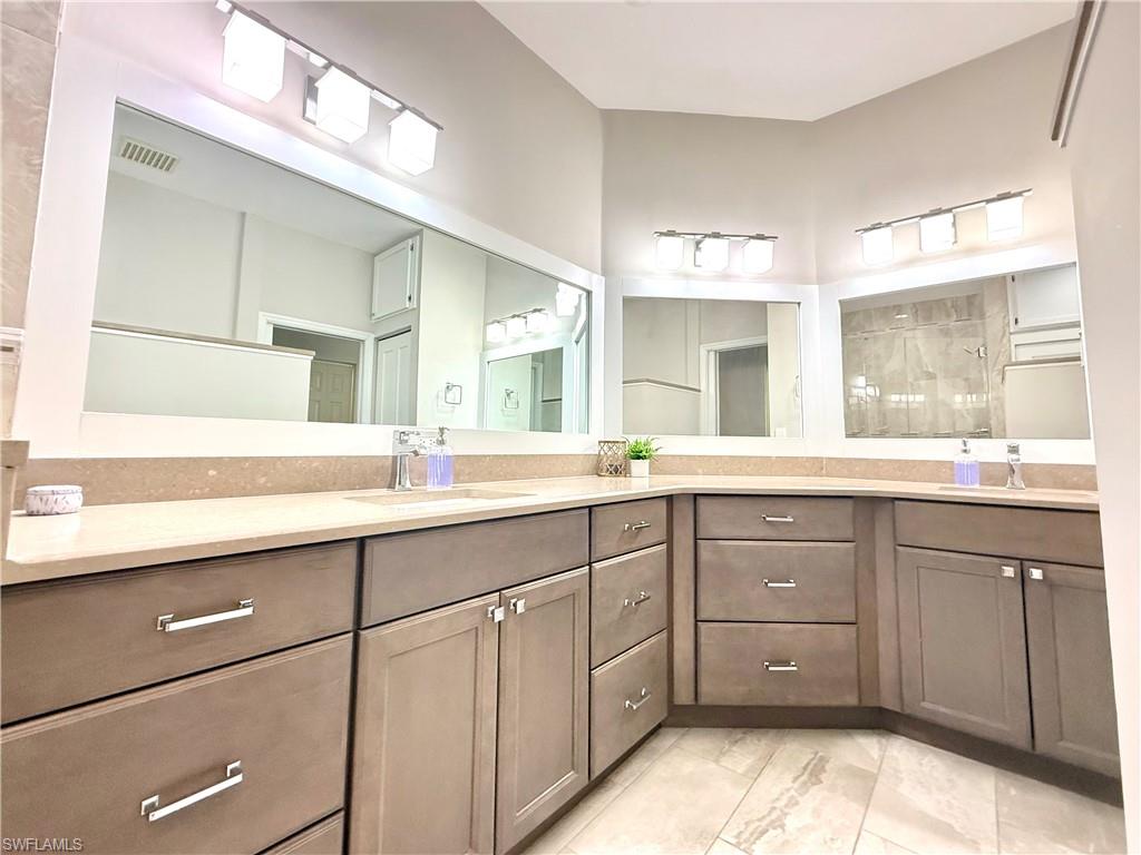 Bathroom featuring double vanity