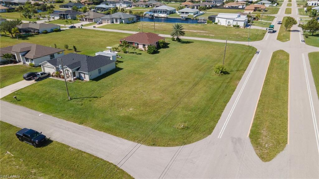 Aerial perspective of suburban area with a nearby body of water