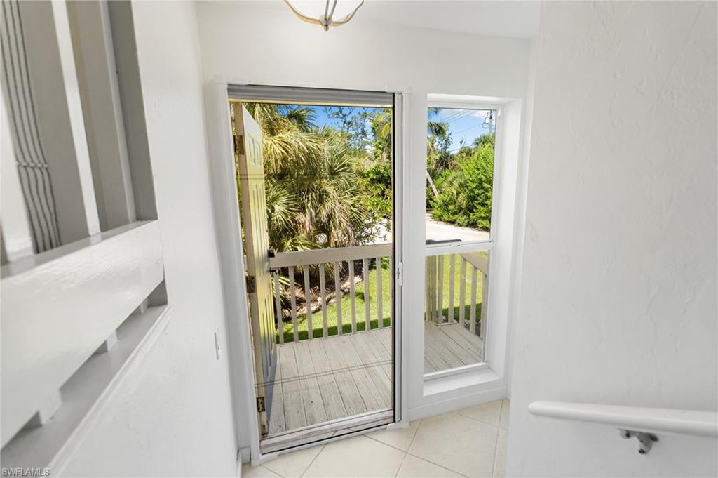 Doorway with tile patterned floors