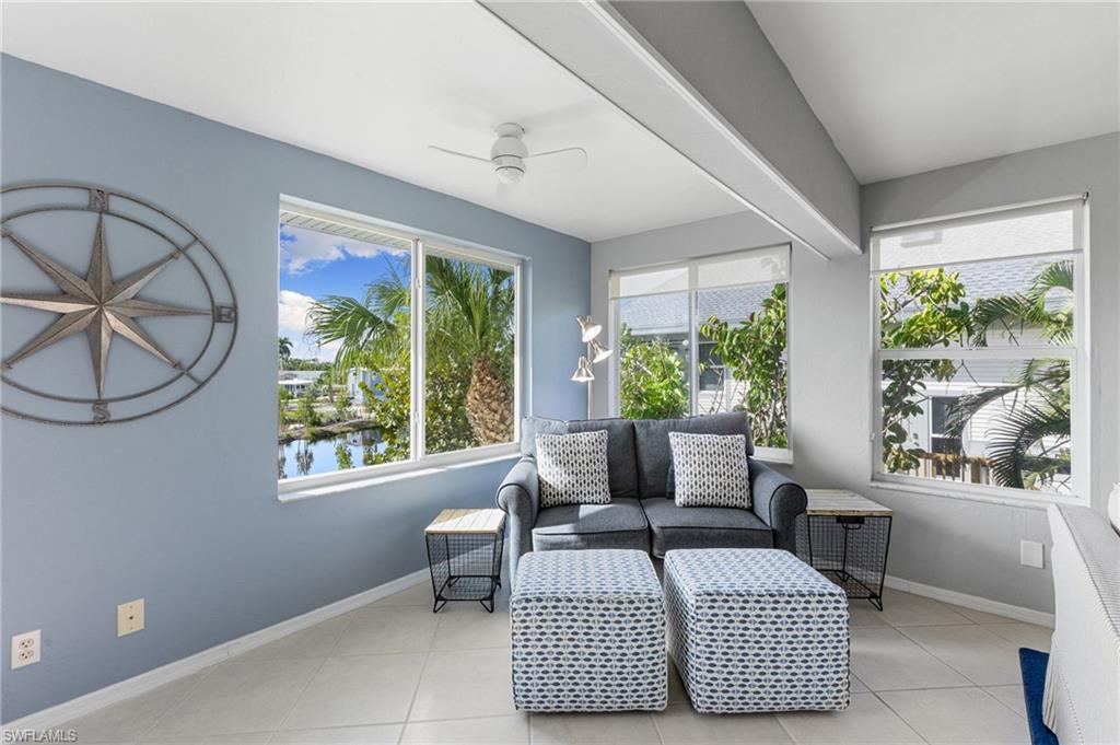 Sunroom with a water view