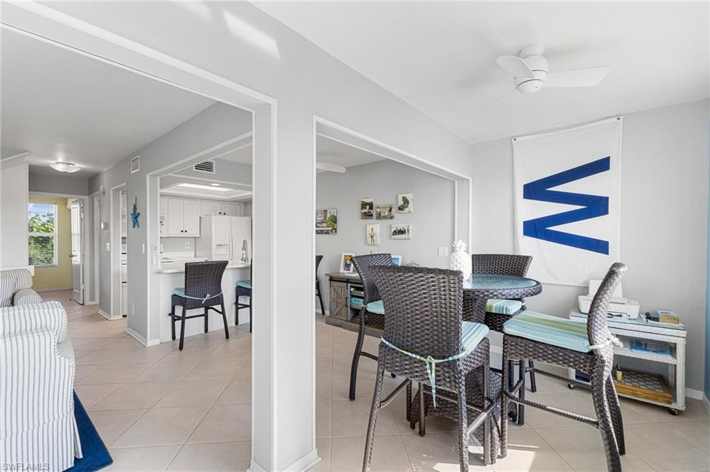 Dining room featuring light tile patterned floors and ceiling fan