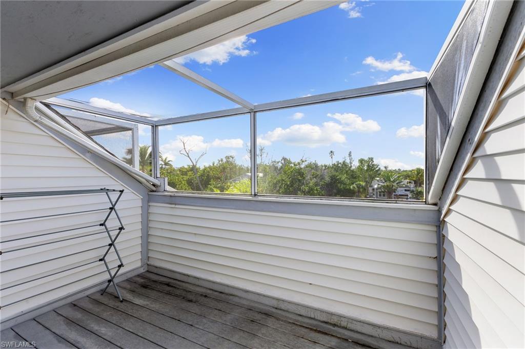 Deck featuring a sunroom