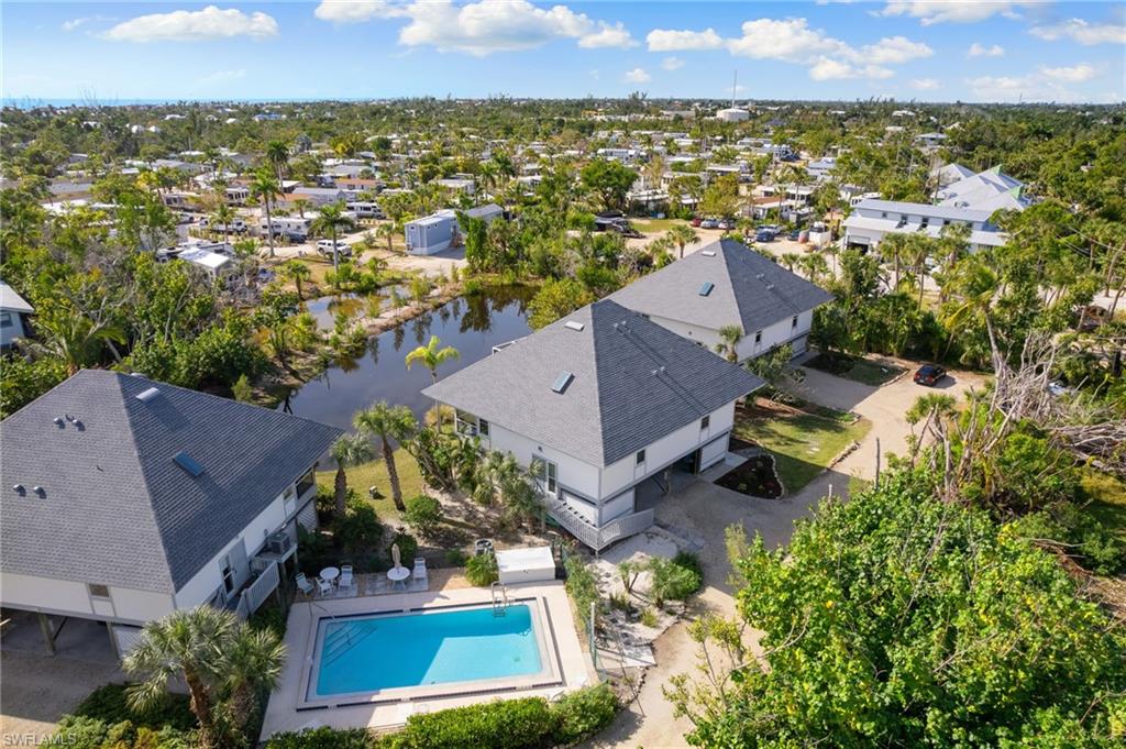 Aerial view of a nearby body of water and a pool area
