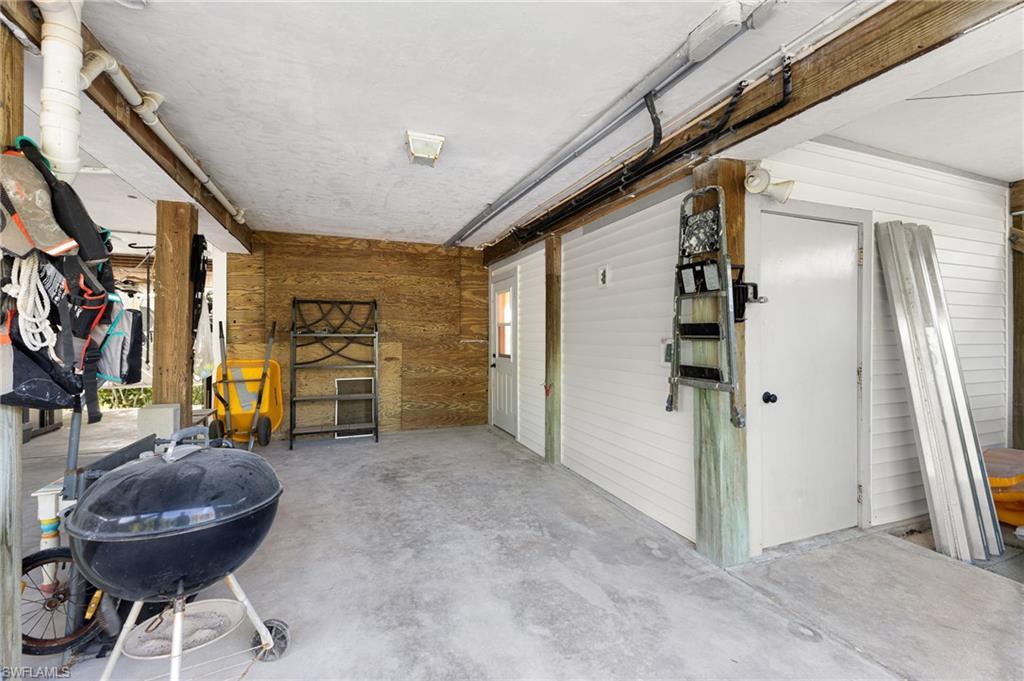 Garage featuring wooden walls