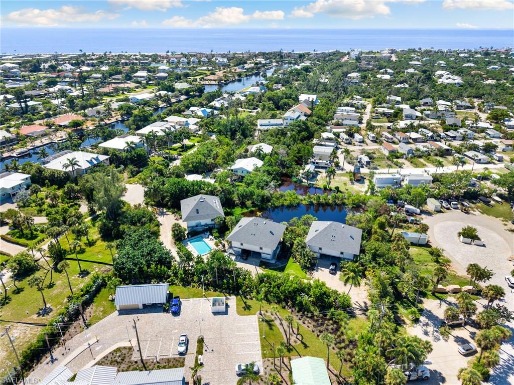 Aerial view of residential area featuring a large body of water