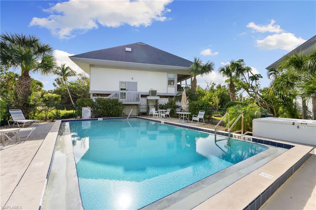 Community pool featuring a patio and a balcony