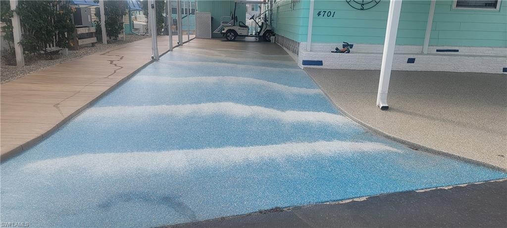 New Decorative Driveway depicts Beach Scene. The boardwalk on the left, ocean waves in center and beachy sand on the right. Awesome!