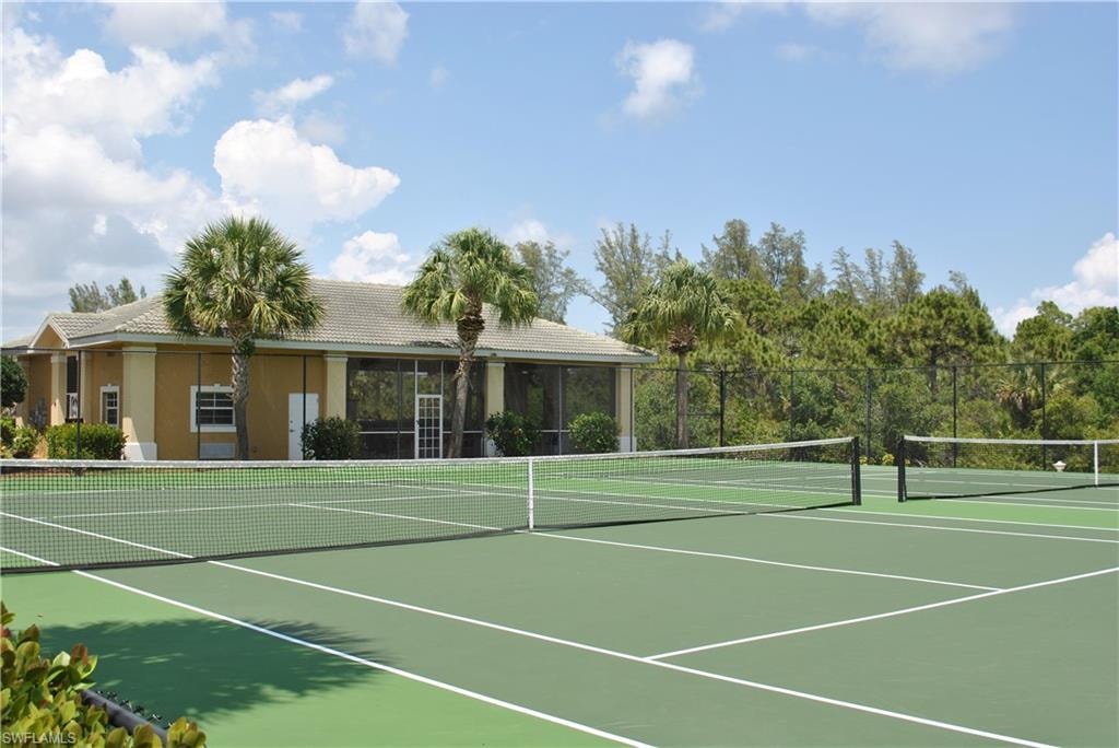 View of tennis court featuring community basketball court