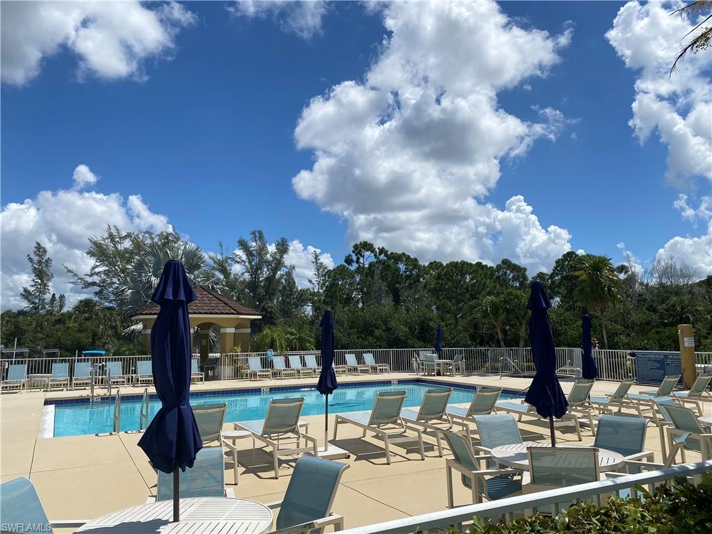 Community pool featuring a patio