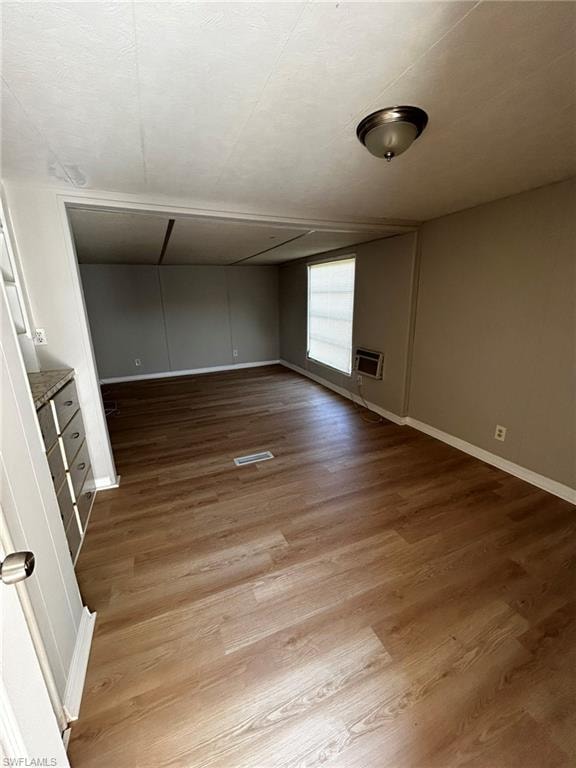 Spare room with light wood-style flooring and baseboards