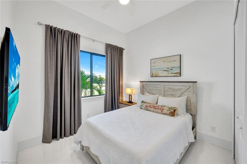Bedroom with a closet and ceiling fan
