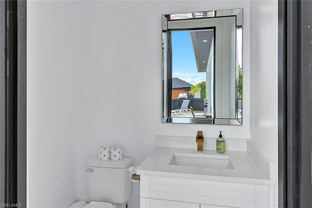 Pool Bathroom with vanity and toilet
